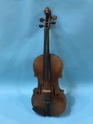 A violin, bears paper label 'Henry Betts Maker Royal Exchange London', with carved lion head
