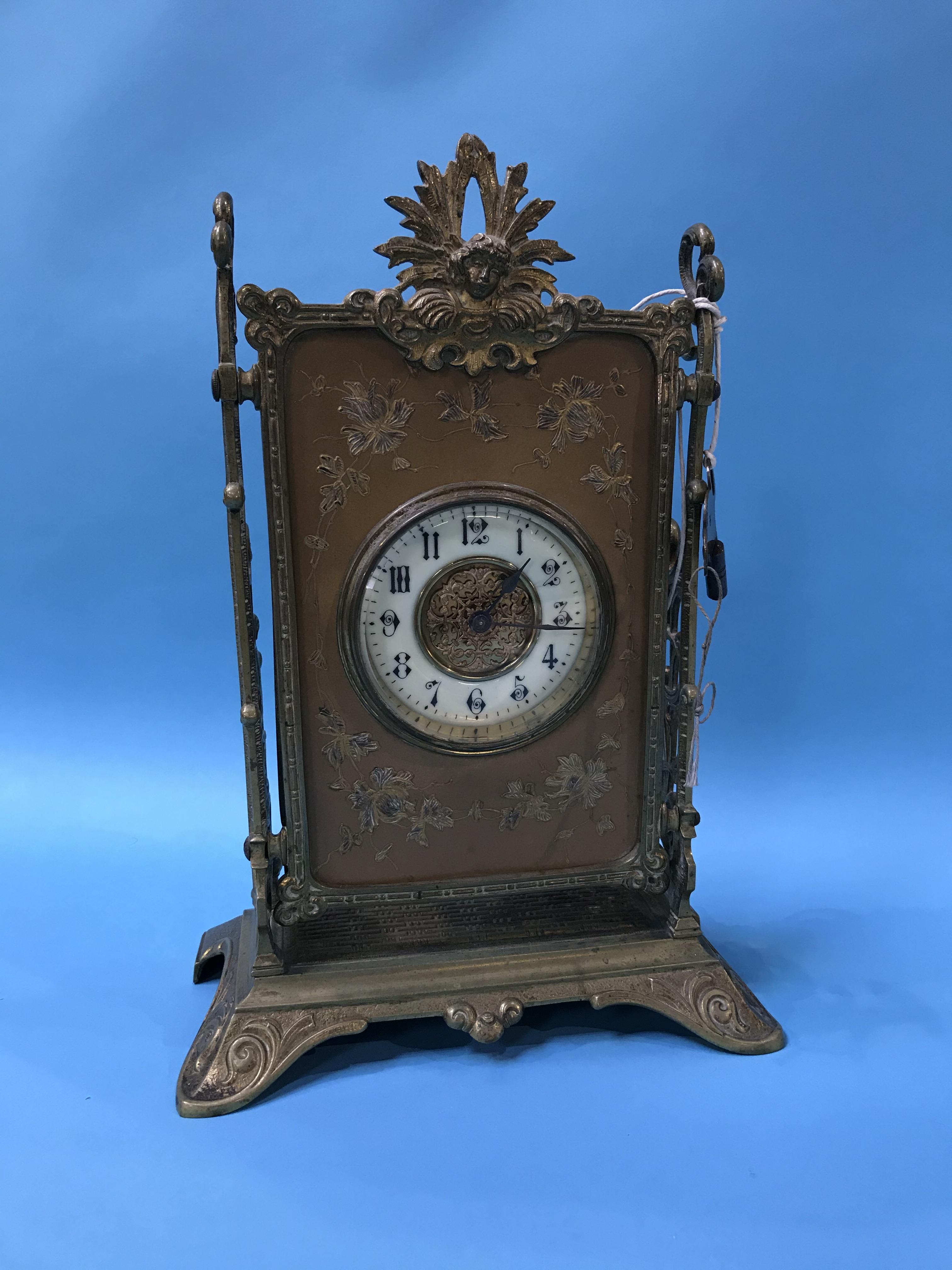 A Continental decorative brass mantle clock