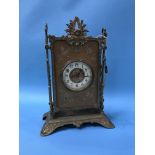 A Continental decorative brass mantle clock