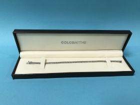 An 18ct white gold Tennis bracelet, stamped '750' and 'Dia 300', 100g, 18cm