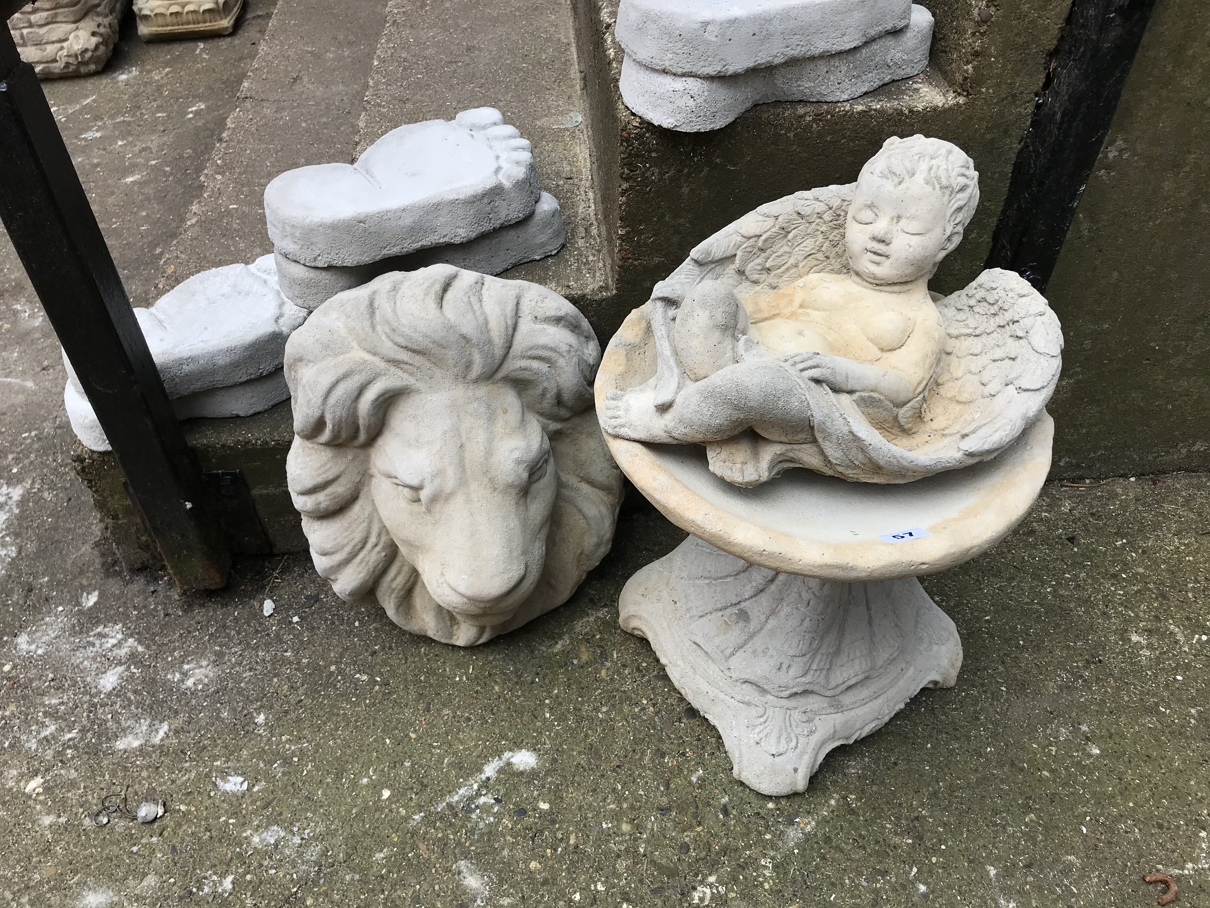 Garden statuary: Small bird bath and two wall masks