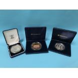 Three silver five ounce coins, in cases, 15oz