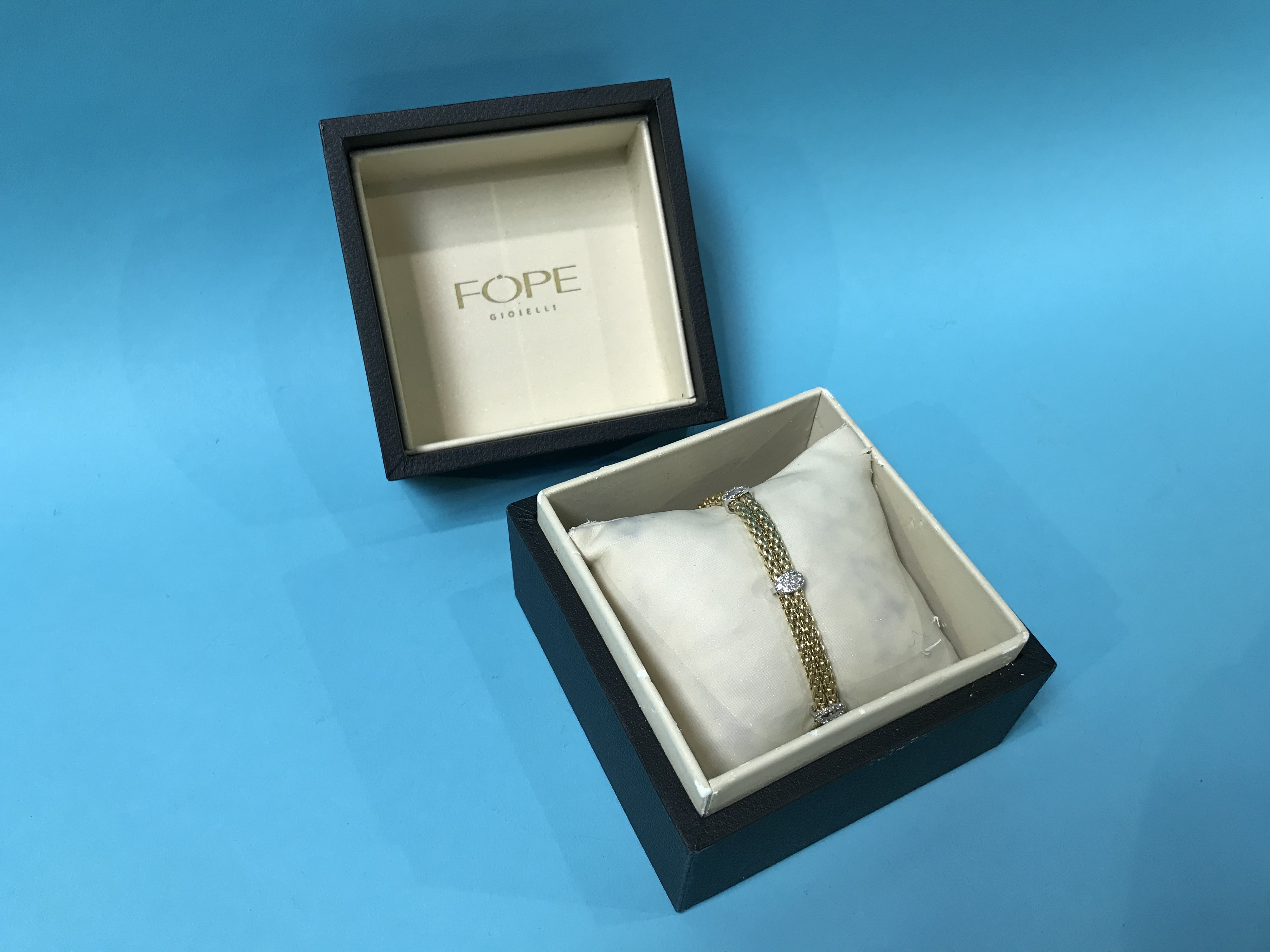 A boxed Fope 18ct diamond and gold bracelet, stamped '750' and 'CT 0.29', 19g, 19cm