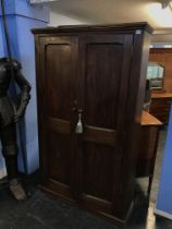 A pitch pine double door school cupboard, W 111cm, D 32cm and 183cms Height