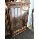 Oak leaded bookcase with shelves