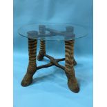 A glass top occasional table with four zebra leg feet, diameter 49cm