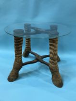 A glass top occasional table with four zebra leg feet, diameter 49cm