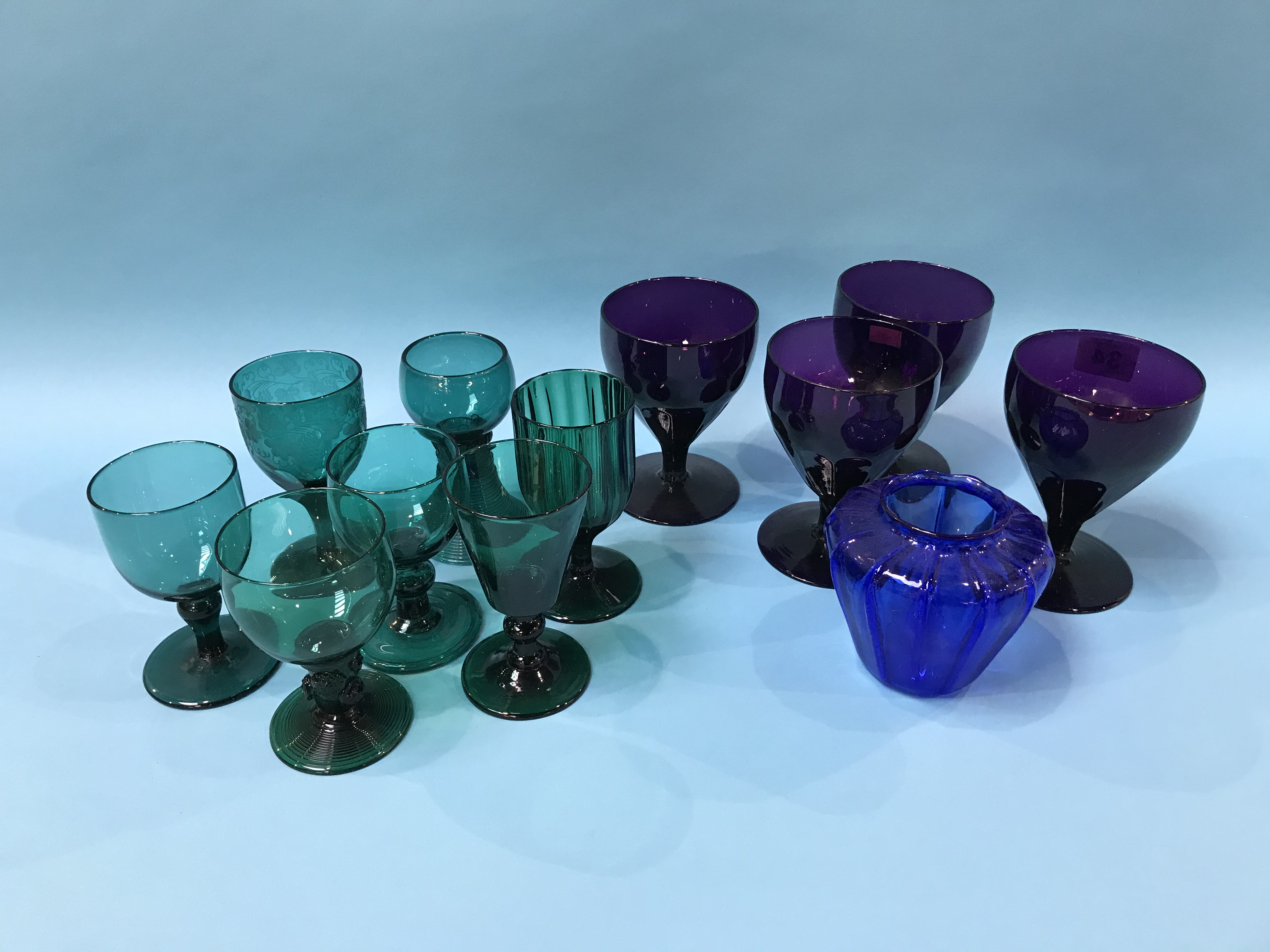 Collection of coloured wine glasses and other glasses
