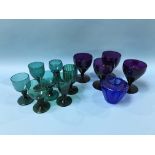 Collection of coloured wine glasses and other glasses