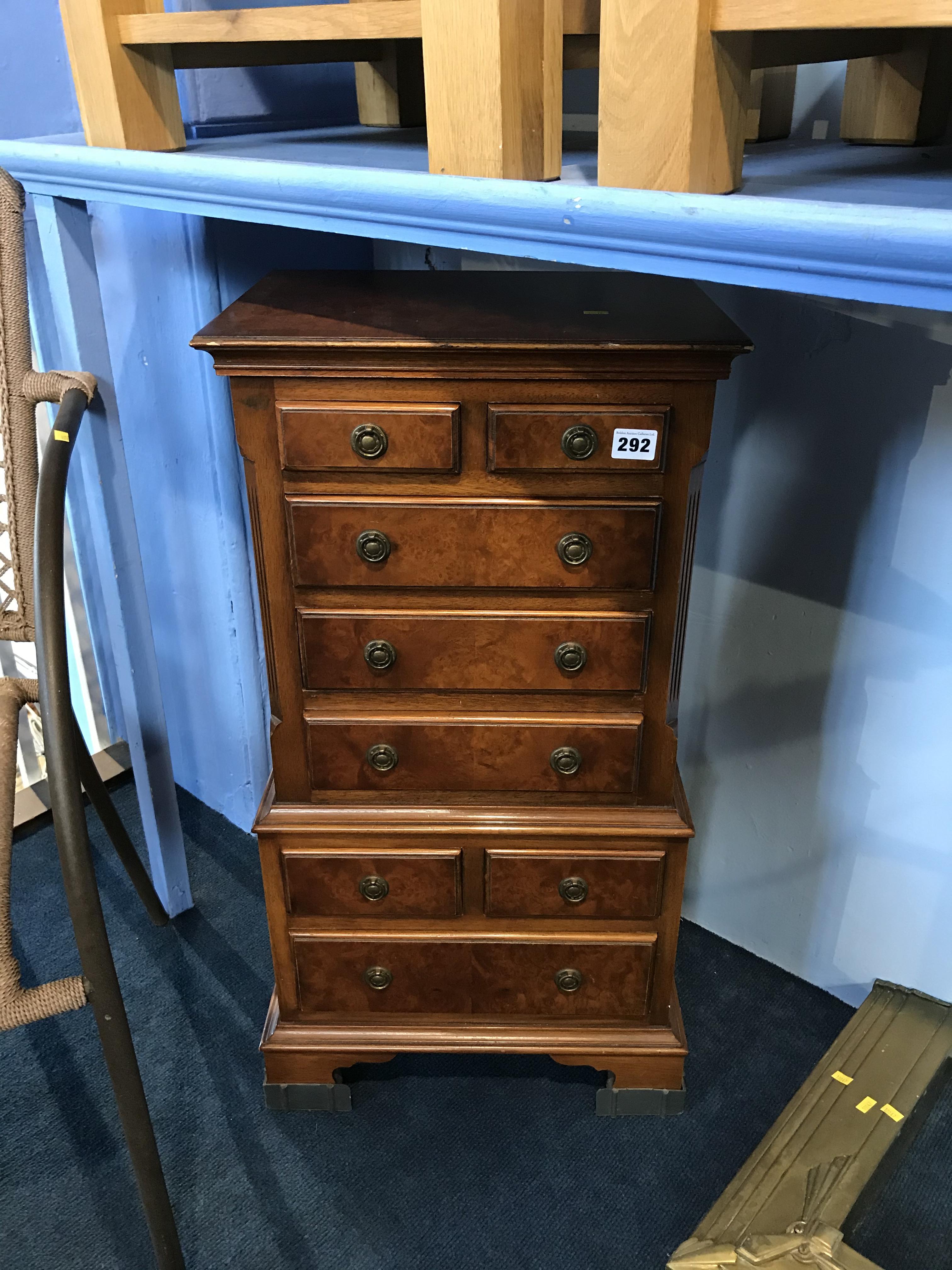 Small reproduction walnut chest of drawers
