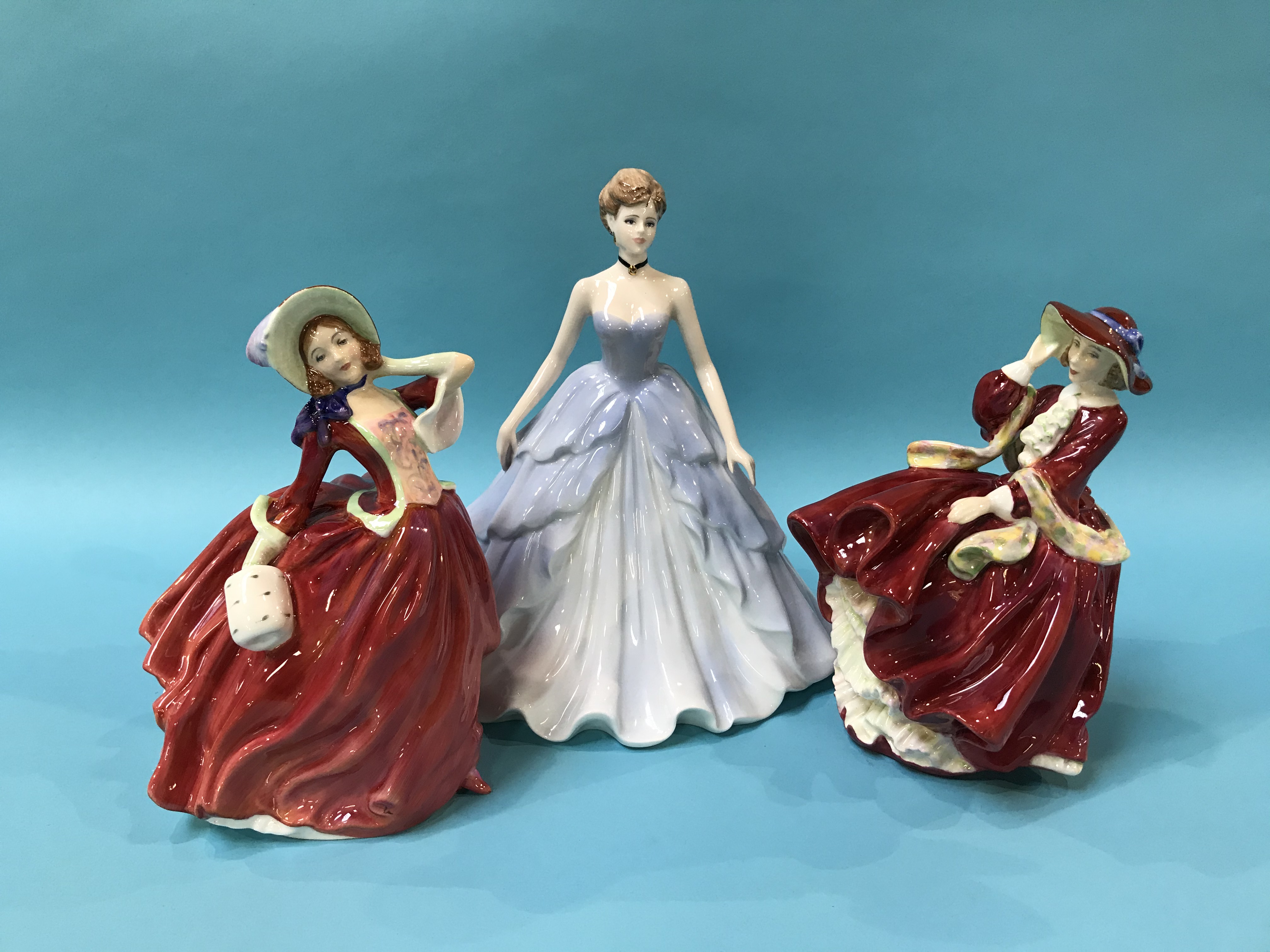 A Coalport figure and two Royal Doulton figures