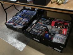 Four trays of Blu-rays, cds etc
