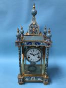 A Cloisonne decorated eight day clock, with strike action