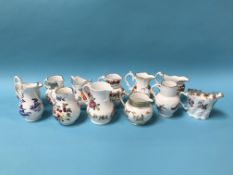 Twelve miniature Royal Worcester cream jugs