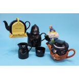 A Carlton Ware 'Wheel Clamp' teapot, Clown teapot and a Policeman with sugar and cream jug