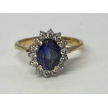 A diamond and sapphire mounted ring and pendant, stamped '750', 5g, size 'L'