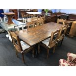 A large refectory dining table, with six chairs
