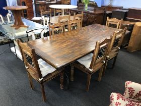 A large refectory dining table, with six chairs