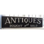 Modern black and white sign 'Antiques Bought and Sold'