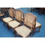 A set of six Continental walnut and bergere chairs