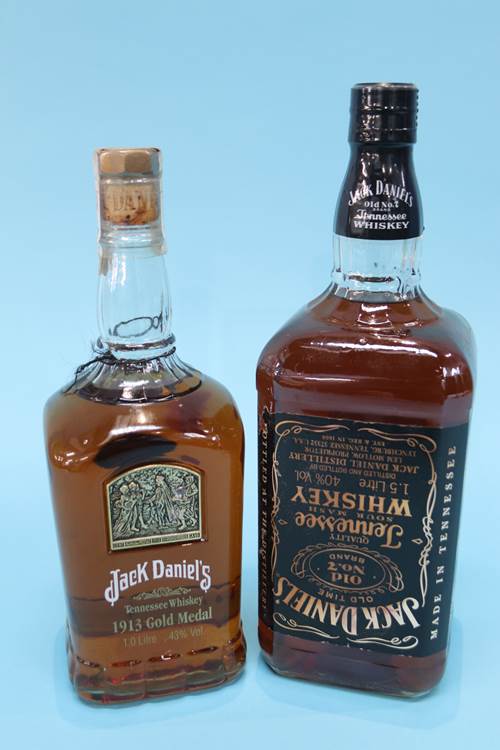 A litre bottle of Jack Daniel's 1913 Gold Medal whiskey and 1.5 litres of Jack Daniels