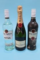 A bottle of Moet Chandon Imperial champagne and two bottles of Bacardi