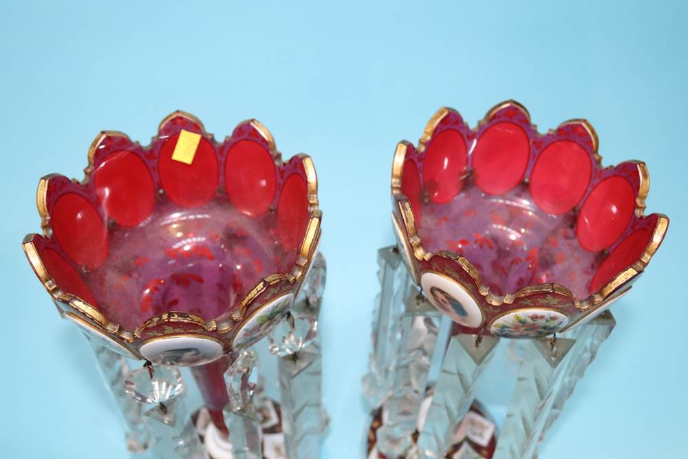 A pair of Victorian Bohemian style red lustres, each with enamelled decorative portraits, floral - Image 6 of 13