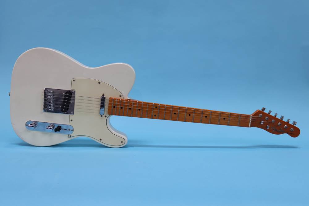 A Fender type 'Telecaster' guitar, made in the USA, cream colour, Corona California, serial number