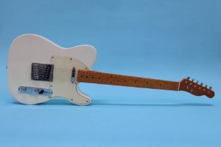 A Fender type 'Telecaster' guitar, made in the USA, cream colour, Corona California, serial number