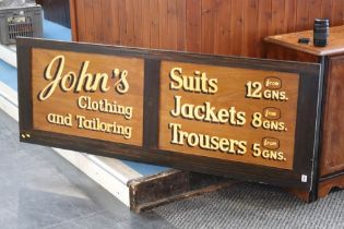 Hand painted sign 'Johns Clothing and Tailoring'