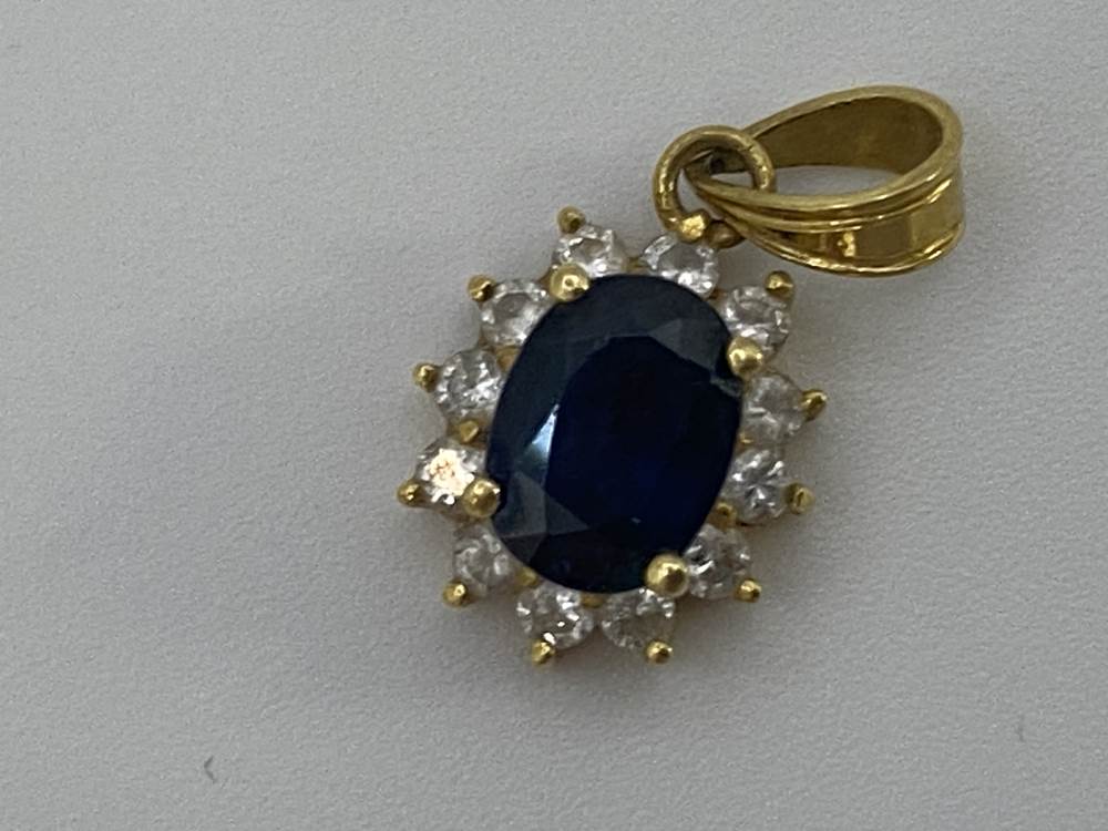 A diamond and sapphire mounted ring and pendant, stamped '750', 5g, size 'L' - Image 2 of 2