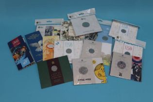Royal Mint uncirculated coin packs, six 50p, five £2 and three £5
