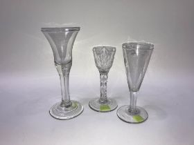 A 19th century etched conical ale glass, an etched wine glass and another tear drop glass (3)