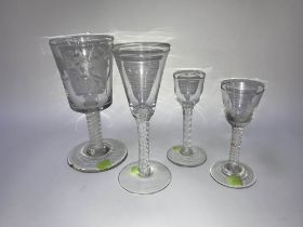 Three various Georgian opaque air twist wine glasses and a modern opaque airtwist glass