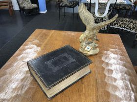 Leather bound Browns bible and a heavy brass eagle