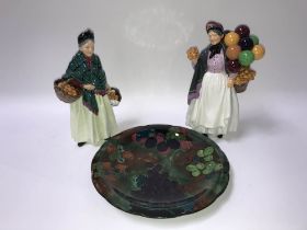 Royal Doulton 'Biddy Penny Farthing', The Orange Lady' and a Titian Ware plate (3)