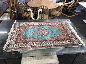 A Persian design small silk rug, 118 x 76cm