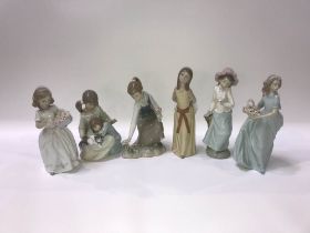 Five Lladro figures and one Nao figure of a girl holding a Dove (6)