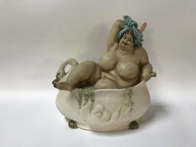 A 2005 Wonderful World model of a lady scrubbing her back in the bath