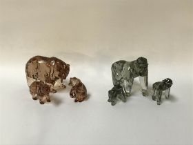 A Swarovski Gorilla and her two babies and a Bear with her two bear cubs (boxed)