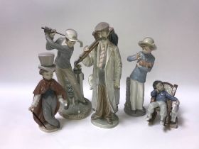 Four Lladro figures and one Nao of a boy holding a puppy