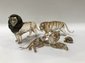 A Swarovski Lion and two Lionesses (boxed)