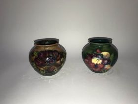 Two small squat shaped Moorcroft vases, H 7cm
