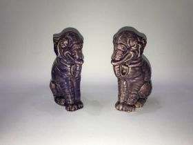 A pair of purple china Elephants