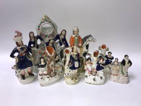 Eight Staffordshire figures