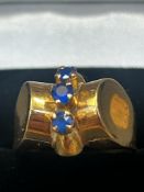 An unusual designer ring set in 18ct gold with thr