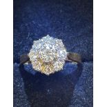 18ct Gold ring set with 9 diamonds inscribed 18ct