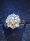 18ct Gold ring set with 9 diamonds inscribed 18ct