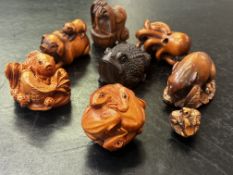 Collection of eight finely carved wooden netsuke f
