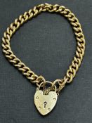 9ct Gold bracelet with heart locket and safety cha